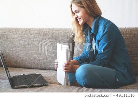 Happy young woman student or employee excited by reading good news Happy young woman student or employee excited by reading good news 49111116