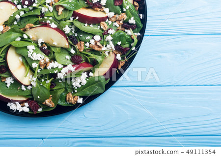 Autumn spinach salad with apple , cheese , walnut 49111354