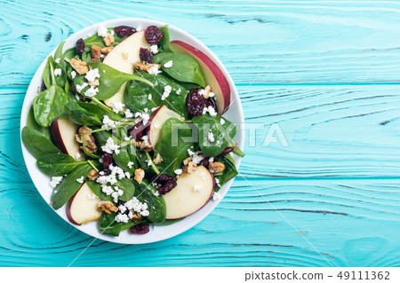 Autumn spinach salad with apple , cheese , walnut Autumn spinach salad with apple , cheese , walnut 49111362