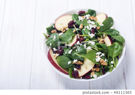 Autumn spinach salad with apple , cheese , walnut 49111365