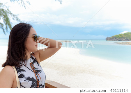Woman tourist on the beach in Thailand Woman tourist on the beach in Thailand 49111514