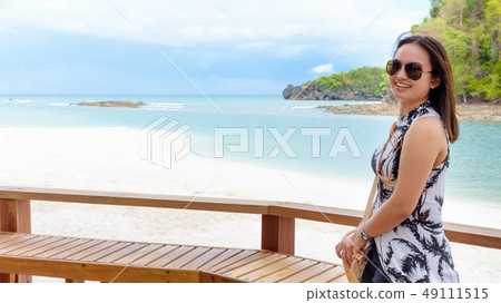 Woman tourist on the beach in Thailand Woman tourist on the beach in Thailand 49111515