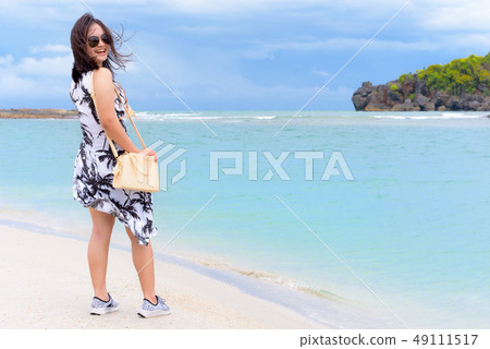 Woman tourist on the beach in Thailand Woman tourist on the beach in Thailand 49111517