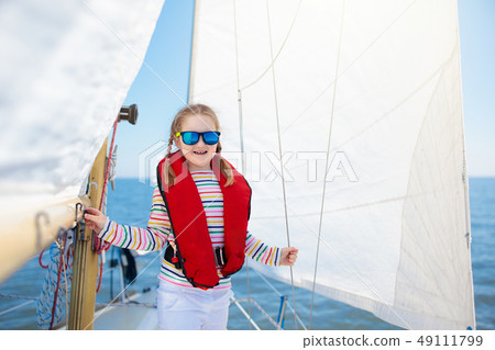 Kids sail on yacht in sea. Child sailing on boat. 49111799
