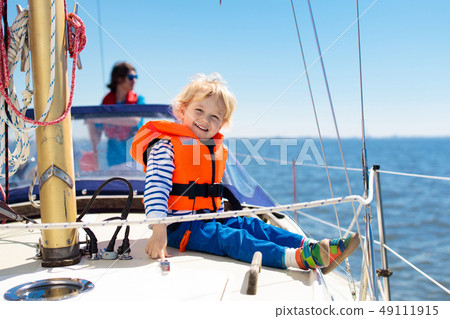 Kids sail on yacht in sea. Child sailing on boat. 49111915