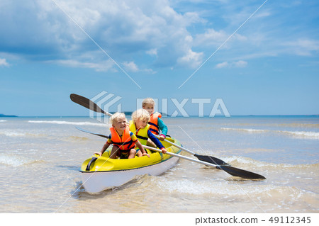 Kids kayaking in ocean. Children in kayak in 49112345