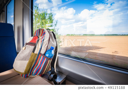 Backpack on the train near the window. Travel 49115188