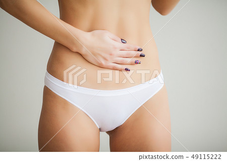 Woman Health Problem. Closeup Of Female With Fit Slim Body In Panties Holding White Card With Sad 49115222