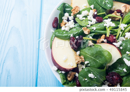 Autumn spinach salad with apple , cheese , walnut 49115845