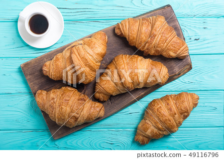 Croissants on wooden background 49116796