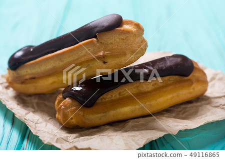 French dessert eclair with chocolate . French dessert eclair with chocolate . 49116865