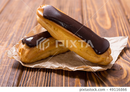 French dessert eclair with chocolate . 49116866