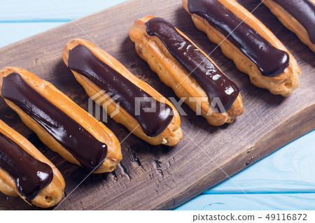 French dessert eclair with chocolate . 49116872