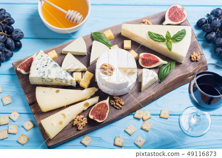 Cheeseboard with cheese brie , parmesan , Cheeseboard with cheese brie , parmesan , 49116873