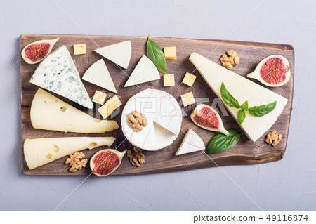 Cheeseboard with cheese brie , parmesan , 49116874