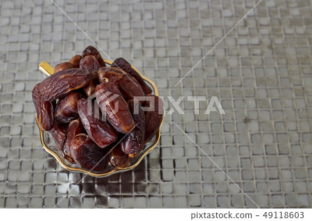 Palm Dates on silver floor Palm Dates on silver floor 49118603