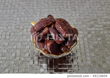 Palm Dates on silver floor Palm Dates on silver floor 49118604