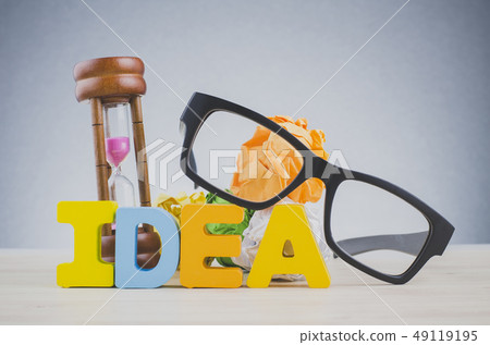 word IDEA on wooden desk over dark background 49119195