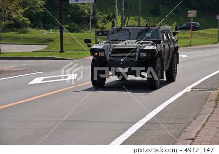 A light armored mobile vehicle "Light Armor" traveling along the national road in Hokkaido 49121147