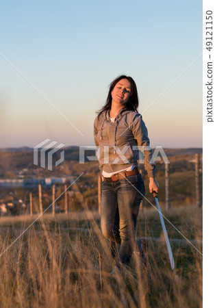 Girl on a high mountain trains with a machete Girl on a high mountain trains with a machete 49121150
