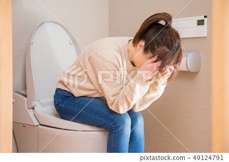 Woman who is troubled in the bathroom 49124791