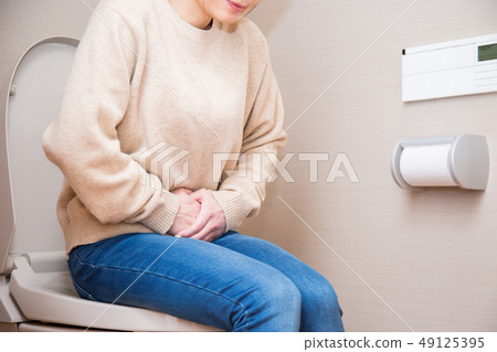Woman sitting in the bathroom 49125395