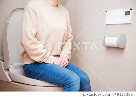 Woman sitting in the bathroom Woman sitting in the bathroom 49125396