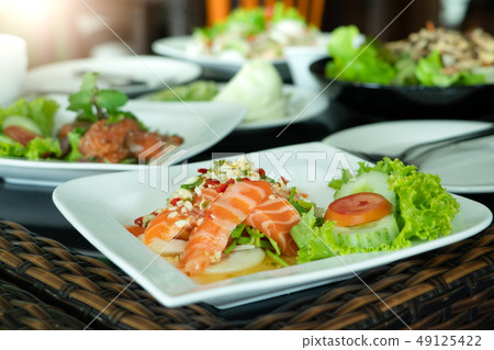 Spicy Salmon Salad with fresh chilli and garlic 49125422