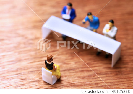 Three interviewers and one woman Three interviewers and one woman 49125838