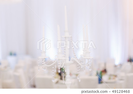 Decoration of tables in restaurant for wedding. Beautiful white decor inside 49128468