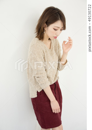 A woman in autumn clothes A woman in autumn clothes 49130722