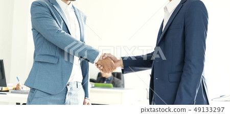 Businessman making handshake agreement.  49133297