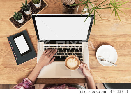Young woman blogger working on his laptop  49133733