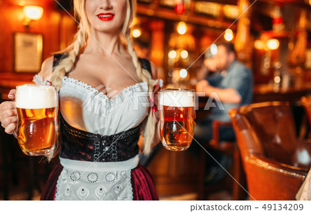 Sexy waitress with large breasts in pub 49134209