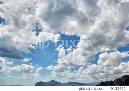 beautiful clouds with the setting sun over the sea 49135811