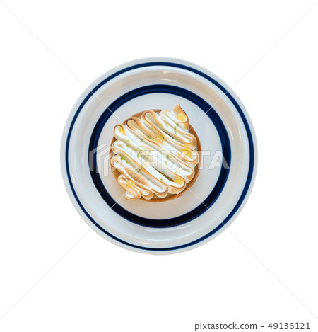Homemade lemon tart decorated with meringue swirls Homemade lemon tart decorated with meringue swirls 49136121
