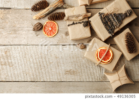 Rustic gift wrapped in craft paper with natural 49136305
