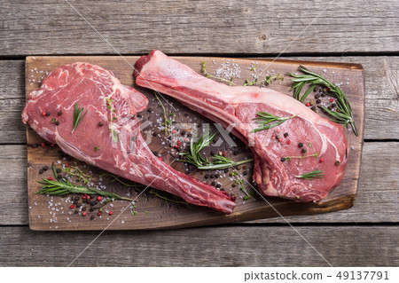 Raw beef tomahawk steak 49137791