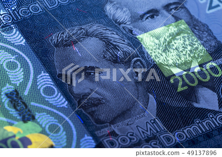 Dominican Pesos in UV rays  49137896