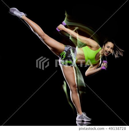 woman exercising fitness exercises isolated black background lightpainting effect 49138728