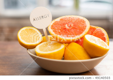 Close up of little bowl with grapefruits and lemons having allergens Close up of little bowl with grapefruits and lemons having allergens 49140503