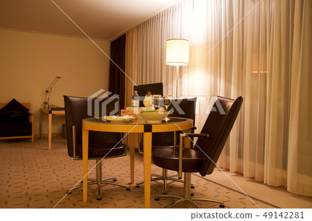 VIENNA, AUSTRIA - APR 28th, 2017: Romantic evening with bottle of red wine, sweets and fruits in the 49142281