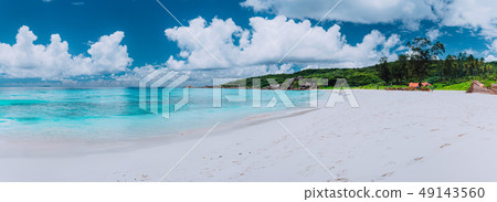 Idyllic panorama sea cloudscape of Grand Anse beach in La Digue island, Seychelles. Pristine white 49143560