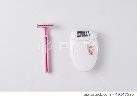 Epilator and razor for shaving on white background 49147580