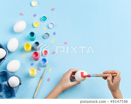 Easter eggs decorating activity.  49147596