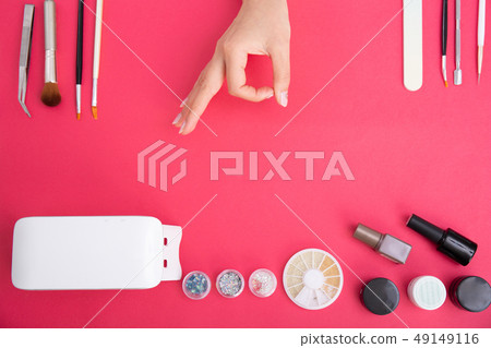 Woman doing jewel nails 49149116