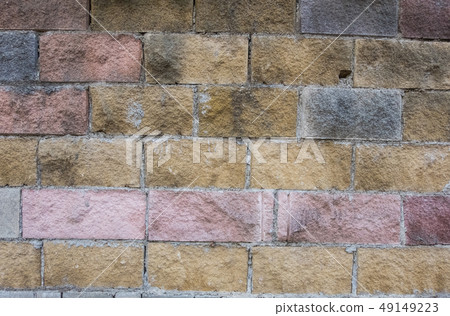 Yellow, red and grey brick shabby dirty wall. Yellow, red and grey brick shabby dirty wall. 49149223