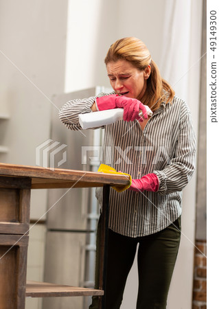 Blond-haired housewife feeling tired of allergy and sneezing Blond-haired housewife feeling tired of allergy and sneezing 49149300