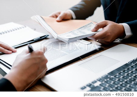 Money in the hands of businessmen who are 49150810