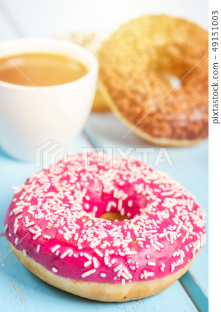 Sweet donuts on black stone table 49151003